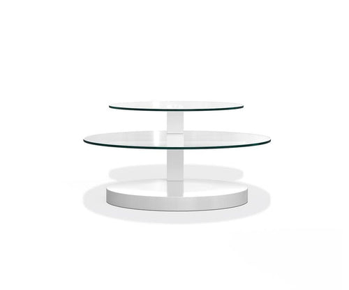 The Adria Coffee Table is a modern, round piece featuring two tiers of tempered glass set atop a central white column and a solid white base, showcasing contemporary design against a plain white background.