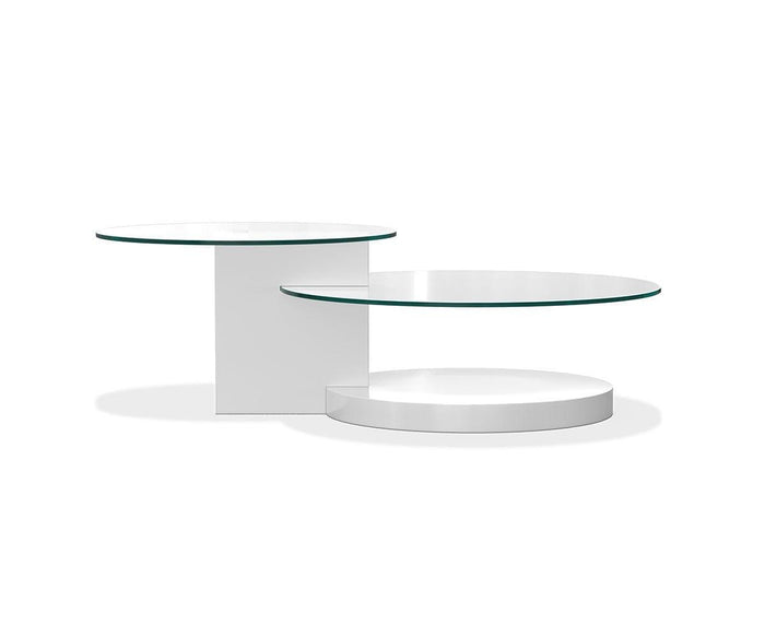 The Adria Coffee Table is a modern piece featuring two round tempered glass tops at varying heights and a geometric, contemporary design, all finished in white.