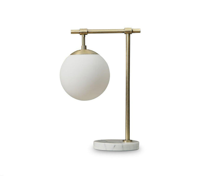 The Aerlig Table Lamp, shown here in Brass-Marble, features a round white glass shade atop a brass-colored metal frame and a circular marble base, all set against a plain white background. This lamp effortlessly combines vintage-inspired elements with modern design for an elegant, timeless appearance.