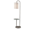 The Amira Shelf Floor Lamp features a sleek silver metal base, a built-in round glass side table, and a white cylindrical shade for a clean, contemporary look.