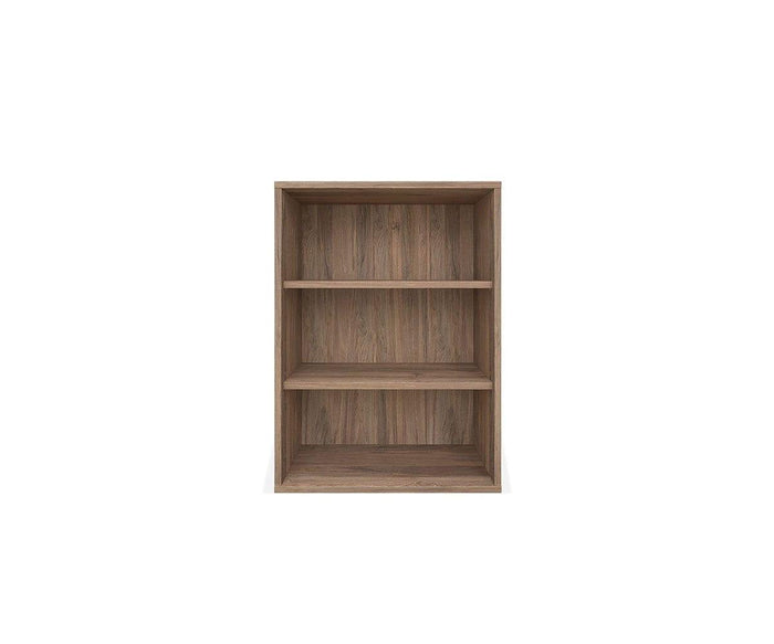 The Arren Low Bookcase in walnut melamine, a simple, medium-height eco-friendly piece with three empty shelves, stands against a plain white background.
