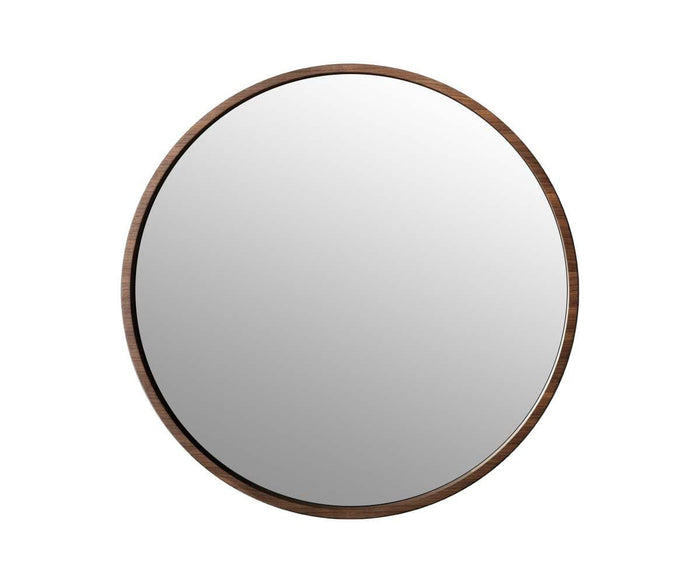 The Baptisia 35″ Round Mirror features a thin walnut frame that exemplifies modern artistry, creating a refined accent against the plain white background.