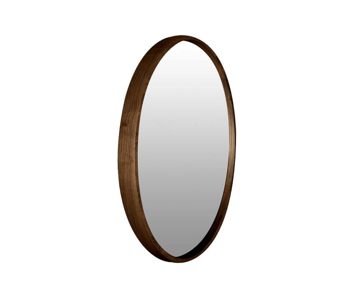 The Baptisia 35″ Round Mirror features a thick, dark brown wood frame that embodies modern artistry, shown angled on a white background.