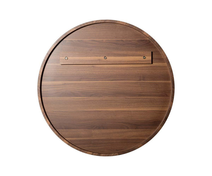 The Baptisia 35″ Round Mirror features a circular frame crafted from natural wood with a smooth finish and visible wood grain, highlighted by a horizontal wooden strip accented with three screws near the edge. Reminiscent of modern artistry, its design evokes the elegance of a contemporary round mirror set against a plain white background.