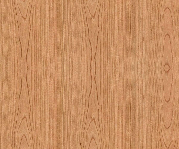 This light brown wood surface features a natural grain pattern with wavy, vertical lines and symmetrical oval shapes, finished in a polished cherry tone—an elegant look often showcased in the Baptisia End Table or as an artistic backdrop reminiscent of cubist sculptures.
