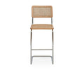The Bendt Bar Stool, shown in BENDT NATURAL, features a woven cane seat and backrest, European beech wood frame accents, and metal legs. It is displayed from the front against a plain white background.