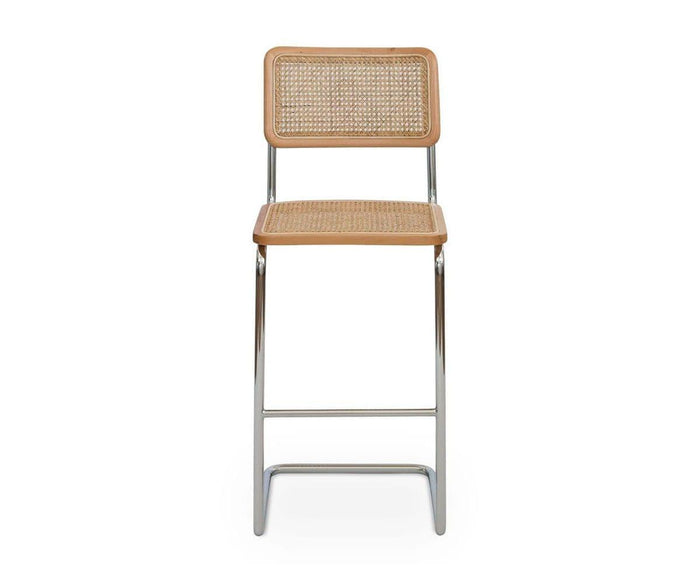 The Bendt Bar Stool, shown in BENDT NATURAL, features a woven cane seat and backrest, European beech wood frame accents, and metal legs. It is displayed from the front against a plain white background.