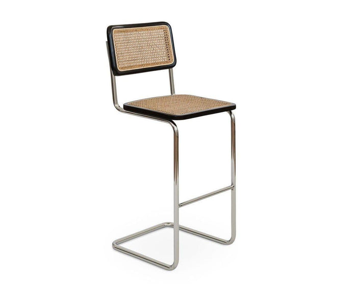 Introducing the Bendt Bar Stool: a modern counter-height chair inspired by mid-century bar stool silhouettes, featuring a chrome metal frame, European beech wood accents, and cane webbing seat and backrest framed with striking black borders.