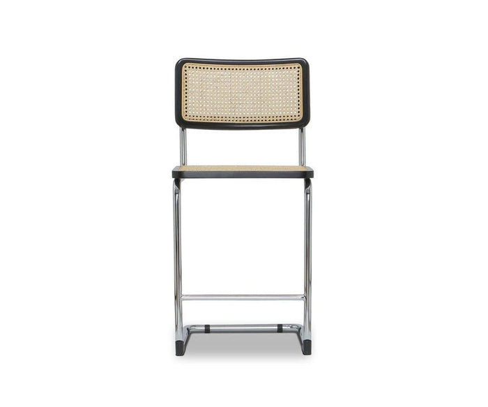 Shown against a plain white background, the Bendt Counter Stool in Bendt Natural/Black features a modern metal frame, a mid-century-inspired cane rattan backrest, and a matching cane seat.