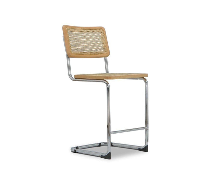 The Bendt Counter Stool features a chrome cantilever frame, light wood seat, and woven cane backrest, shown against a white background—a perfect blend of mid-century style and contemporary design.