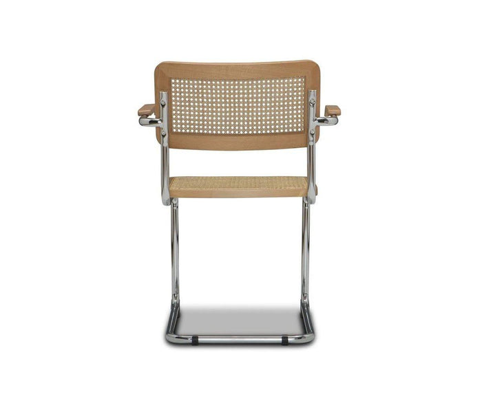 The Bendt Dining Armchair is a modern mid-century chair featuring a cane backrest and seat, wooden armrests, and a chrome tubular metal frame, shown from the back against a plain white background.
