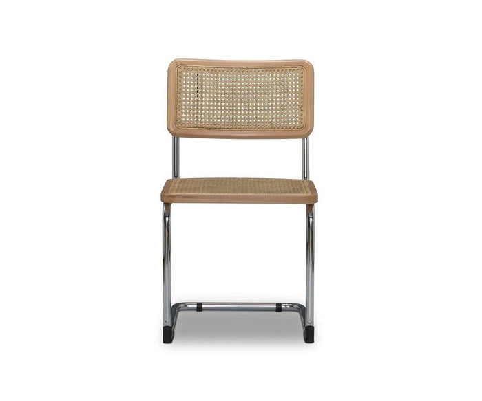 A front view of the Bendt Dining Chair in BENDT NATURAL, featuring a light beech wood frame, woven cane backrest and seat, and cantilever-style metal legs, set against a white background.