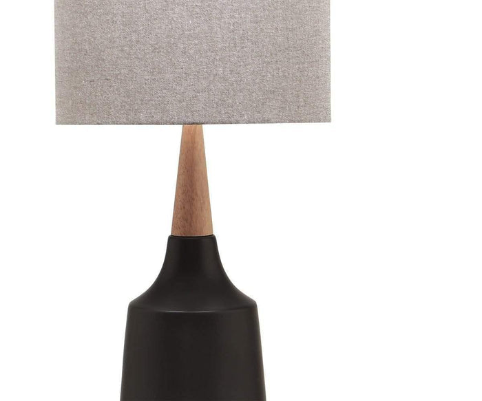 The Bergset Table Lamp is showcased against a plain white background, featuring a matte black ceramic base, a wooden neck, and a grey fabric drum shade.