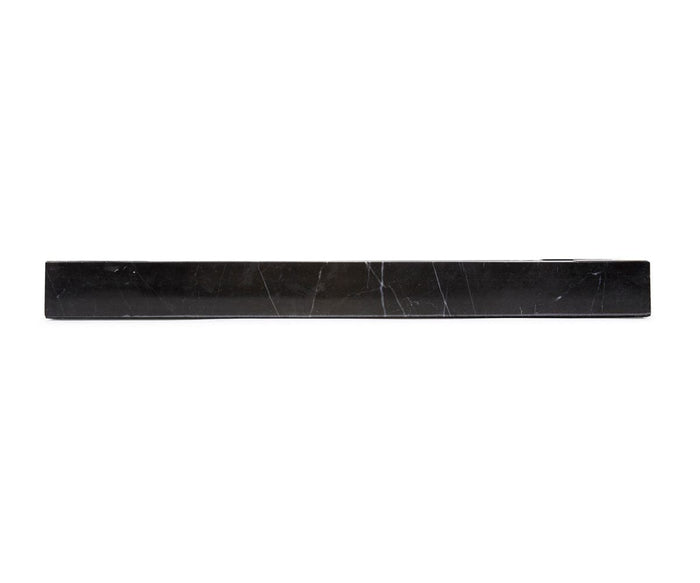 The Black Mirrored Marble Tray is a long, rectangular piece featuring subtle white veining and is displayed against a white background.