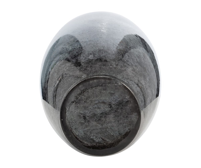A top-down view of the Blue Nebula Vase reveals its dark, glossy, oval-shaped form and textured hand-finished glass surface, set against a white background.