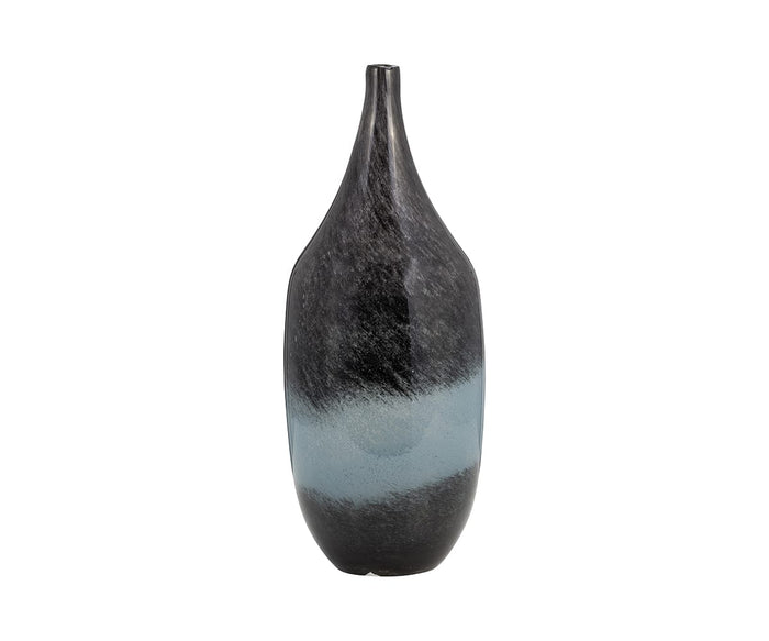 The Blue Nebula Vase is a tall, narrow ceramic piece in blue/multi tones, featuring a glossy black finish and an uneven horizontal blue-gray band around the center, displayed against a white background.