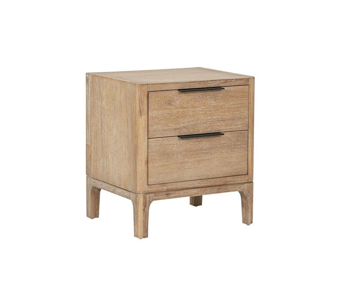 The Camen Nightstand is crafted from solid acacia in a light gray finish. It features two drawers with sleek black horizontal handles and stands on four sturdy legs, all set against a white background.