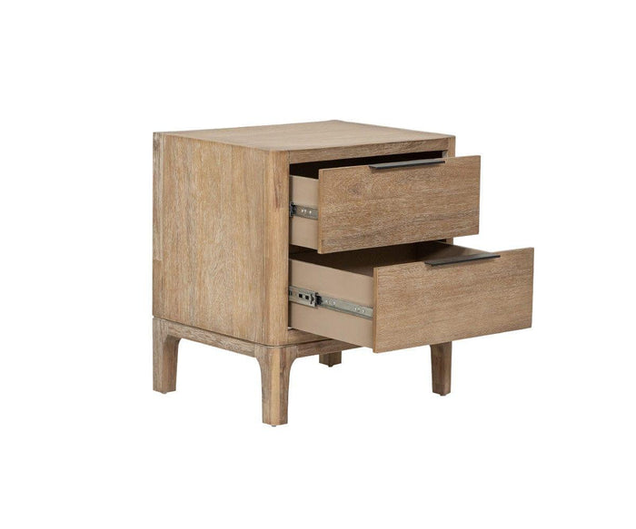 The Camen Nightstand features a solid acacia construction with two drawers, both partially open to showcase the smooth sliding mechanisms within. Finished in a light wood tone, this nightstand stands gracefully on four legs.