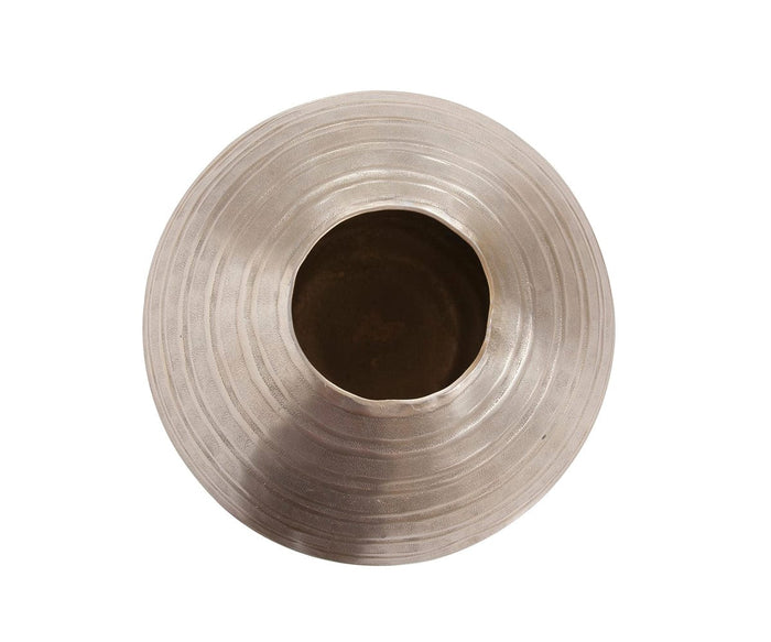 A top-down view of the Chisled Champagne Small Vase, a round, textured modern metal vase with a wide opening, featuring concentric circular ridges and a metallic silver-gray finish. The background is plain white.