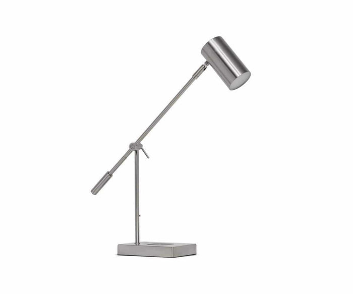 The Collette Desk Lamp with USB Port is a modern, adjustable task light in a sleek silver finish. It features a cylindrical shade angled atop a rectangular base with a convenient built-in USB port, set against a white background.