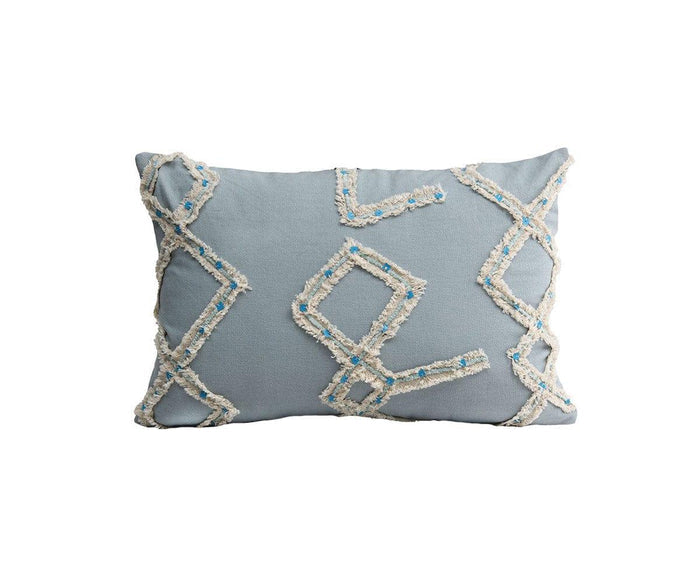 A rectangular Constellation Lumbar Pillow Cover in light blue, featuring a textured cream and blue geometric pattern across the front, photographed on a white background.