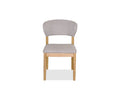 A front view of the Courbe Dining Chair in Natural, Scandi-inspired with a light-colored upholstered seat and backrest. Crafted from sustainable rubberwood, its simple and modern design features four straight legs and a gently curved back for comfortable support.