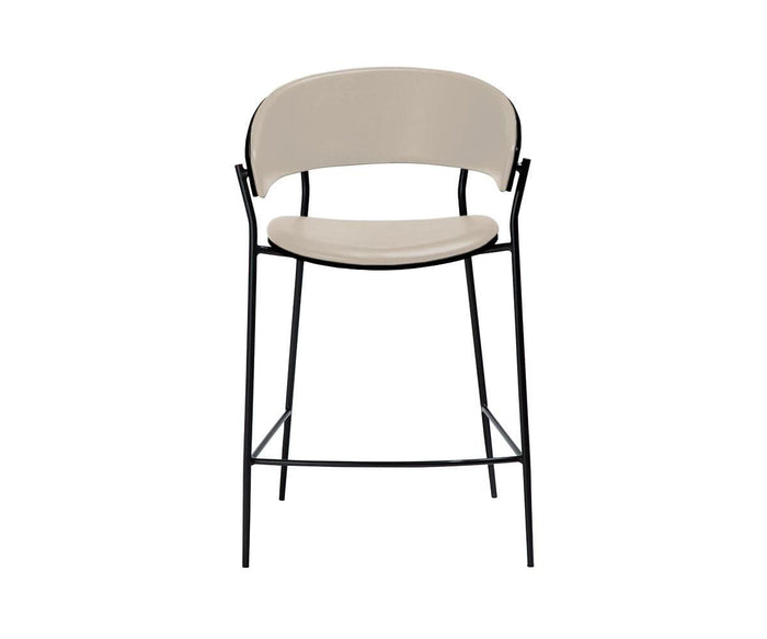 Crib Leather Counter Stool in bone white, featuring a gracefully curved seat and backrest upholstered in premium leather, supported by slender black metal legs with a convenient footrest—showcasing a modern elegance reminiscent of mid-century design, styled against a white background.