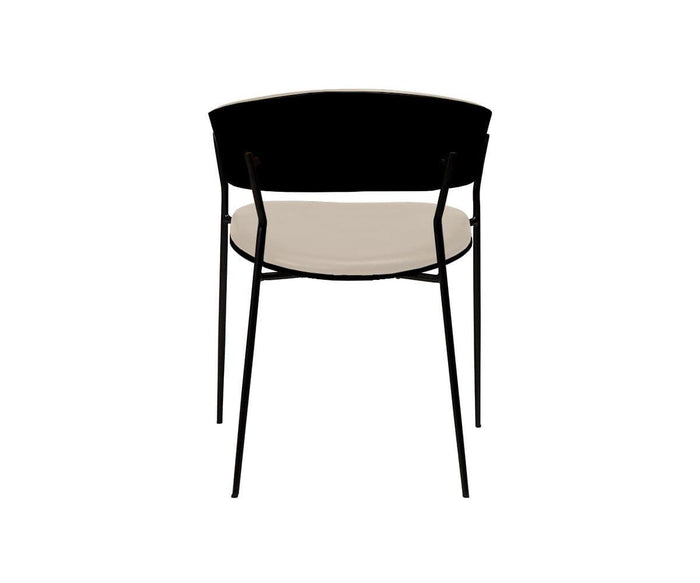 The Crib Leather Dining Chair is shown from the back, showcasing its sleek black frame, rounded black backrest, and light beige seat against a plain white background—an elegant blend of style and comfort that defines this contemporary dining chair.