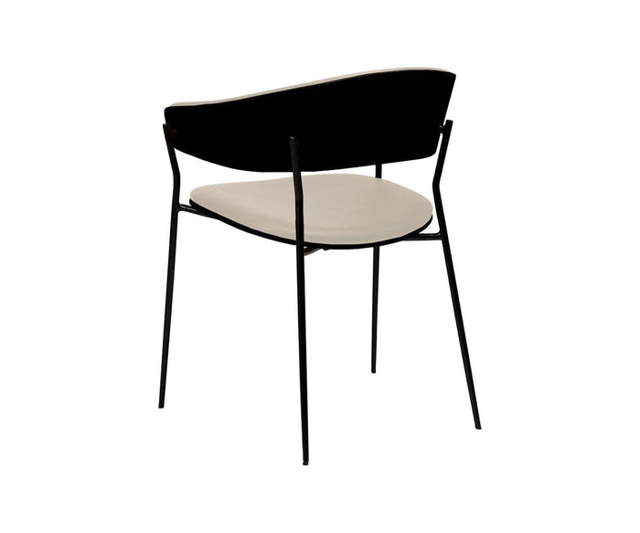 The Crib Leather Dining Chair, designed with a contemporary style, showcases a curved black backrest, black metal legs, and a light beige cushioned seat, as seen from the back against a white background.