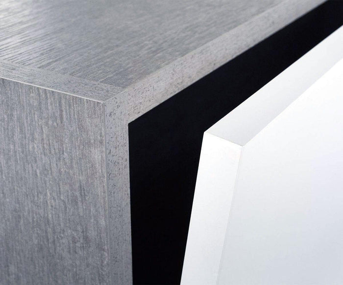 Close-up of the corner of the Danne Horizontal Wall Unit, featuring a textured gray faux-cement finish and a smooth white panel partially open, highlighting its minimalist, geometric design.