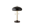 Introducing the Darius Table Lamp in Gold/Black, featuring a modern mid-century design with a round black metal shade, sleek gold vertical stem, and a sturdy black circular base. Equipped with two pull chains, this lamp is pictured on a white background and is perfect as an office desk lamp for contemporary workspaces.
