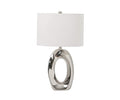 The Darlene Table Lamp showcases a sleek, modern design with its shiny silver, oval-shaped base featuring a hollow center, complemented by a simple white drum lampshade. Reminiscent of a contemporary art sculpture, this lamp adds an artistic touch to any interior.
