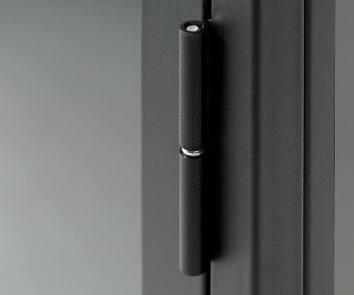 Close-up of a matte black metal hinge attached to the Dion Low Cabinet’s gray door or panel, showcasing smooth, modern surfaces and a minimalistic design—perfect for low cabinets with tempered glass doors in contemporary storage solutions.