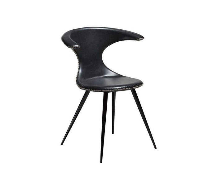 The Drake Dining Chair features modern black faux leather upholstery with a curved backrest that is open on one side, supported by four slender black legs. Visible stitching accents the edges of the seat and backrest, all showcased against a plain white background.