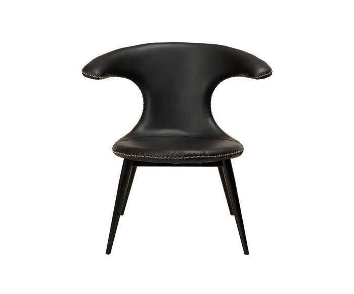 Introducing the Drake Lounge Chair in black, featuring a modern curved wing-like backrest, slender legs, and prominent white stitching accentuating the edges. Expertly crafted from premium faux leather and showcased against a plain white background, this chair seamlessly fuses rustic industrial charm with contemporary elegance.