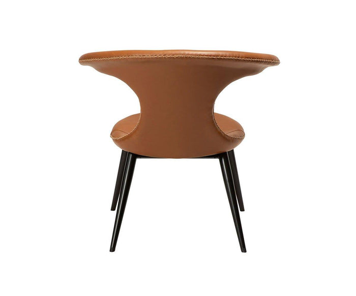 The Drake Lounge Chair features a modern brown faux leather design with a curved backrest, detailed visible stitching along the edges, and four slender black metal legs. Shown from the back against a plain white background, this chair captures rustic industrial style, making it a stylish and versatile choice for any living space.