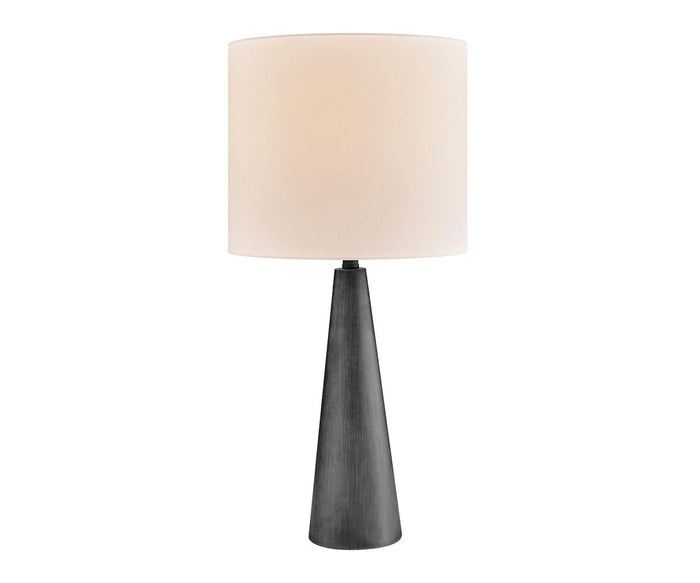 The Dyre Table Lamp features a modern cordless design with a black cement, cone-shaped base and a large white cylindrical lampshade, set against a plain white background. Its weather-resistant construction ensures durability for both indoor and outdoor use.