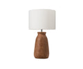 The Earthy Luster Lamp showcases a burnt amber terracotta base with a textured, matte finish and is paired with a large white cylindrical lampshade, set against a plain white background.