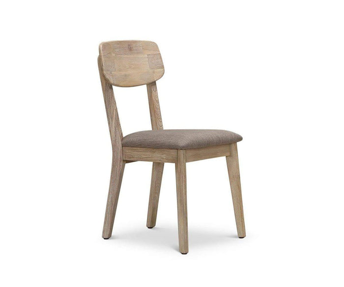 The Eckler Dining Chair features a curved backrest and an upholstered seat, expertly crafted from solid acacia wood, and is displayed at an angle on a white background.