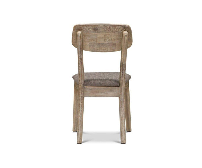 The Eckler Dining Chair is shown from the back against a white background. Crafted from solid acacia, this wooden dining chair features a brown upholstered seat and a simple, classic design with straight legs and a rectangular backrest.
