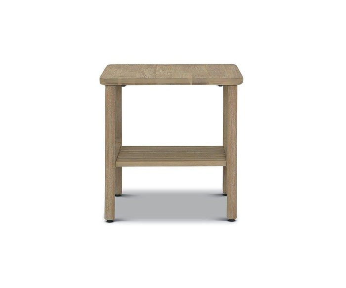 The Eckler End Table is a small, light wood acacia table featuring a square top, a lower slatted shelf, and four sturdy legs, shown against a plain white background.