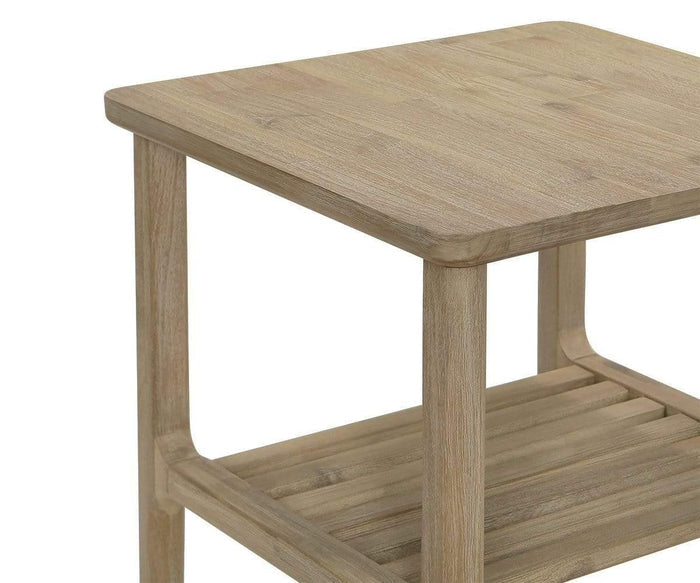 A close-up of the Eckler End Table showcases its light acacia wood construction, square top, slatted lower shelf, smooth rounded edges, and simple modern design.
