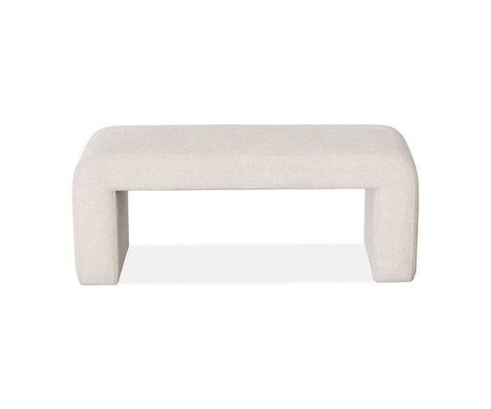 The Eilir Full Bench, featuring a rectangular seat and thick, curved legs upholstered in F07 Beige fabric, provides extra seating and contemporary flair with its modern, minimalist design, shown against a white background.