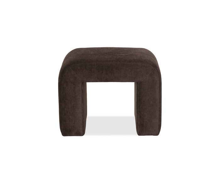 The Eilir Half Bench in F07 Brown is a dark brown, rectangular upholstered ottoman with rounded edges and an open space beneath. Versatile and contemporary, it’s perfect for extra seating or as a stylish half bench in your living space, shown here against a white background.