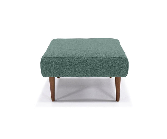 The Ella Ottoman, featuring green 518 upholstery and four angled wooden legs in a mid-century modern style, is photographed from the front against a plain white background.