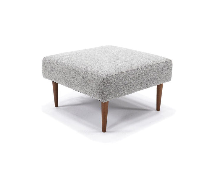 The Ella Ottoman is a square, light gray upholstered piece featuring four tapered wooden legs and showcased against a white background. Its versatile design infuses any room with mid-century modern flair and complements your favorite convertible sofa beautifully.