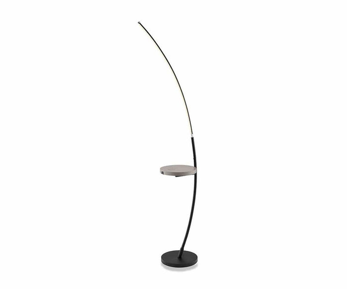 Introducing the Elska Floor Lamp in black—a modern lighting solution featuring a sleek, curved stand and a sturdy round base, complete with an integrated small round side table for extra convenience. The arched LED light extends gracefully from the table’s edge, blending contemporary design with practical functionality—an ideal addition to any modern living space seeking both style and innovation.