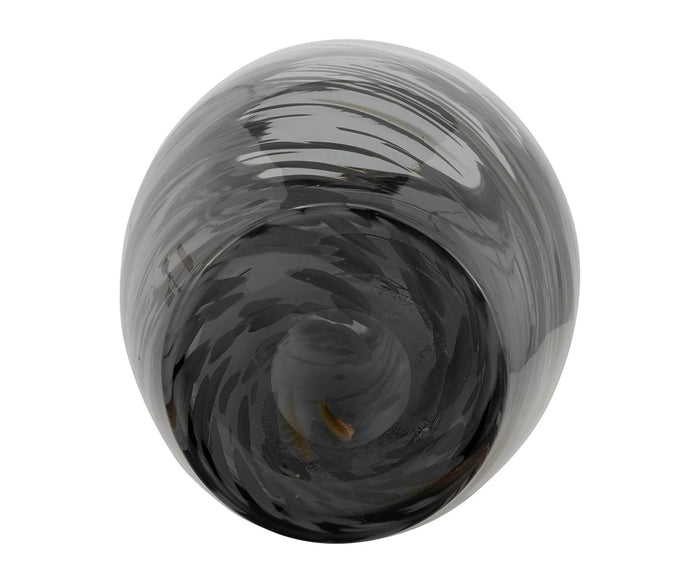The Etched Lattice Vase is a glossy, black and gray hand-finished glass sculpture featuring swirling patterns seen from above, forming a mesmerizing spiral design that creates an illusion of depth—a striking accent piece for any space.