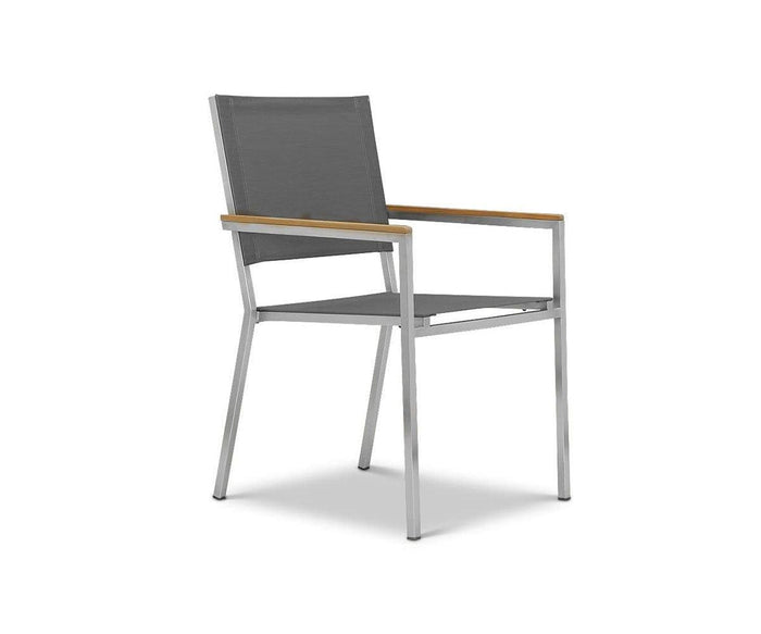 The Farino Outdoor Dining Chair is a modern gray outdoor dining chair featuring metal legs, a mesh seat and back, and wooden armrests. Shown at an angle on a white background, it makes an elegant addition to any modern outdoor furniture collection.