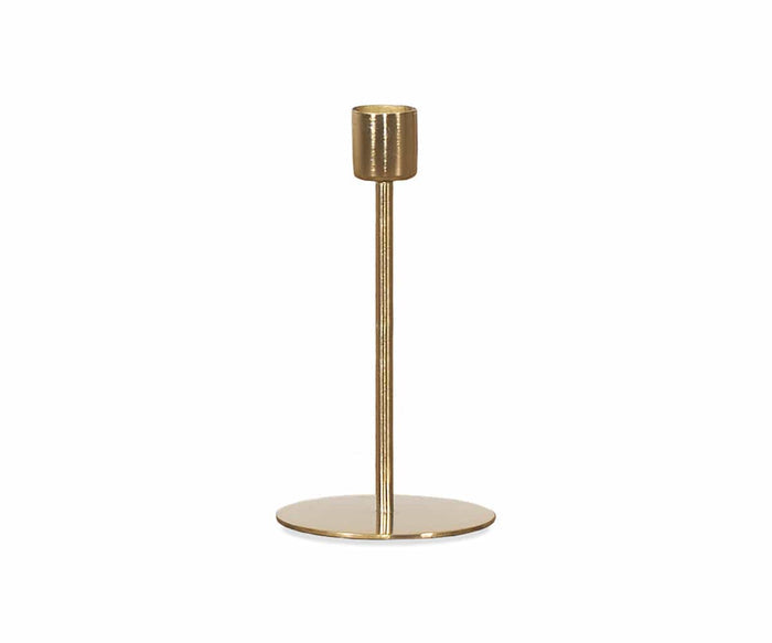 The Fina Candlestick in gold features a round base, a tall slender stem, and a cylindrical holder at the top, showcased against a plain white background—an elegant contemporary piece that adds modern sophistication to any space.